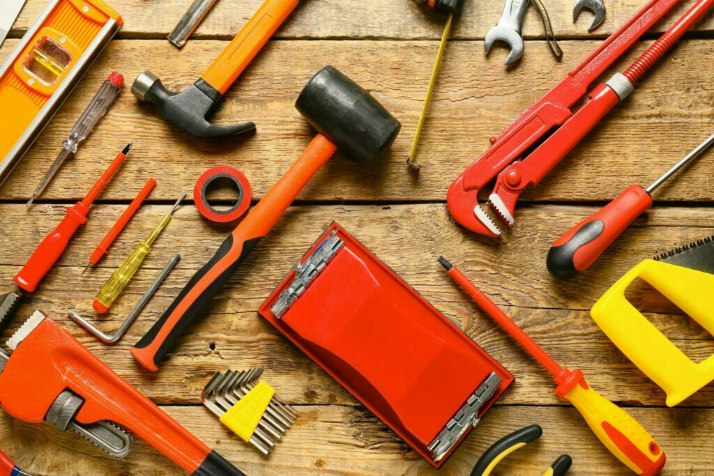 Tools for maintenance. A hammer, rubber mallet, wrench, screwdriver, allen keys, perhaps not common tools for website maintenance in New Zealand.